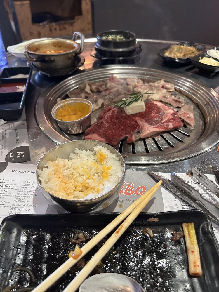Sliced beef on the grill with steamed egg and side dishes